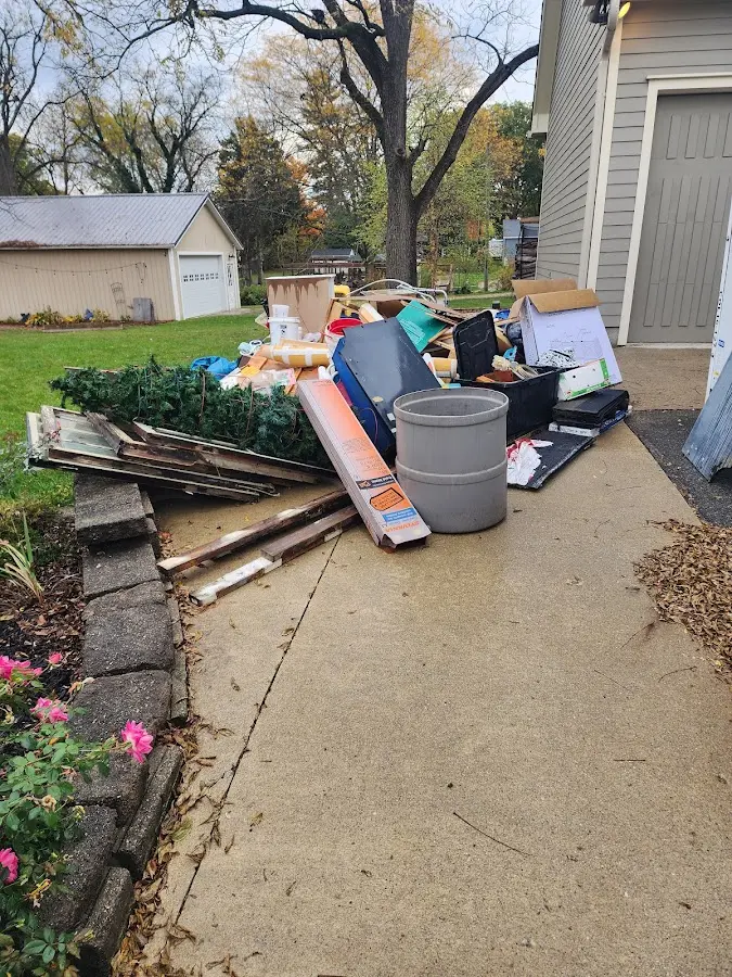 Dumpster being loaded with debris for 3 Yard Dumpster Rental in Stanford